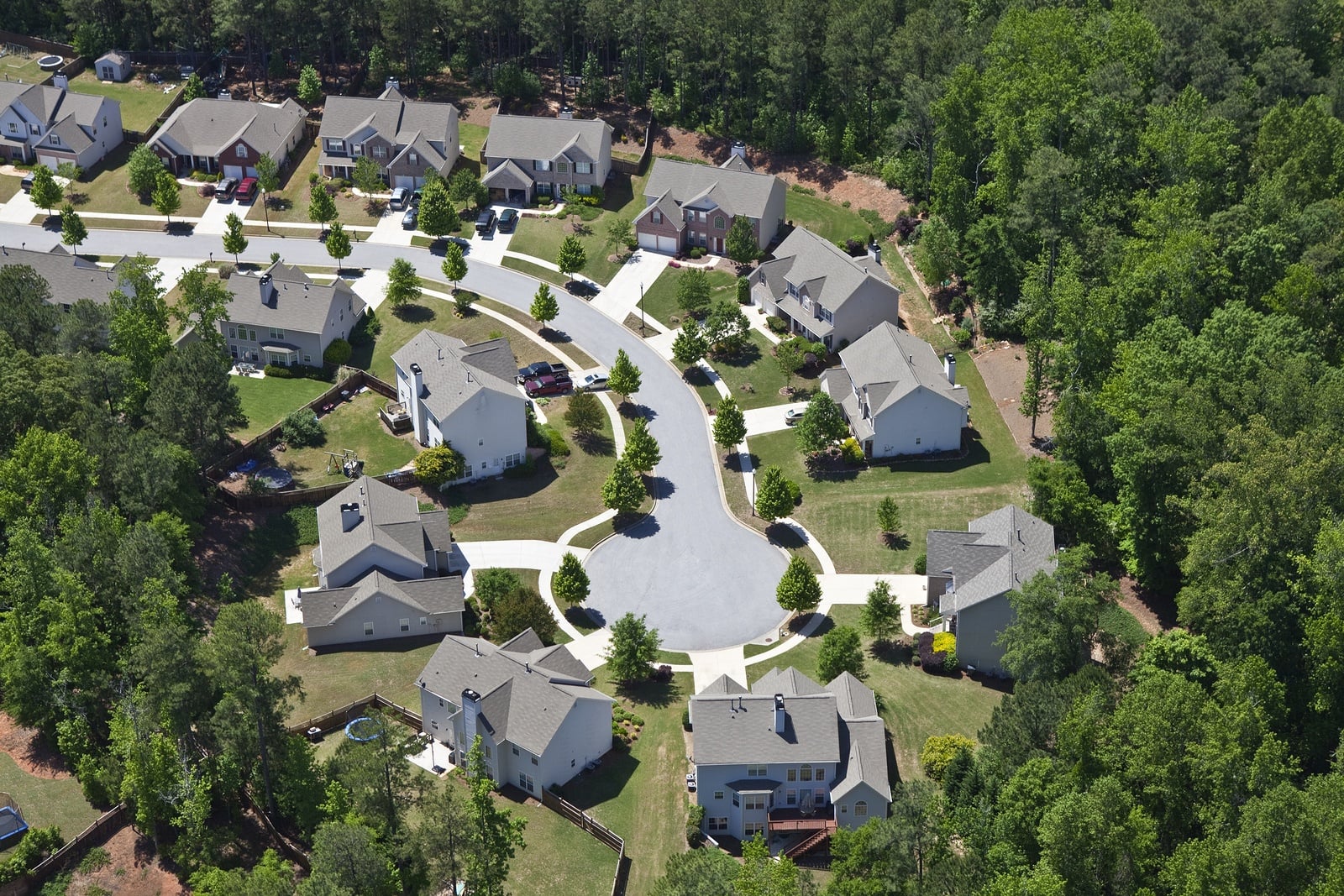 Aerial view of a Lawrenceville, Gwinnett County subdivision with single-family homes on a tree-lined cul-de-sac